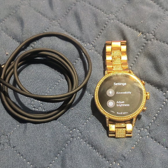 Gold Smartwatch with Black Charging Cable